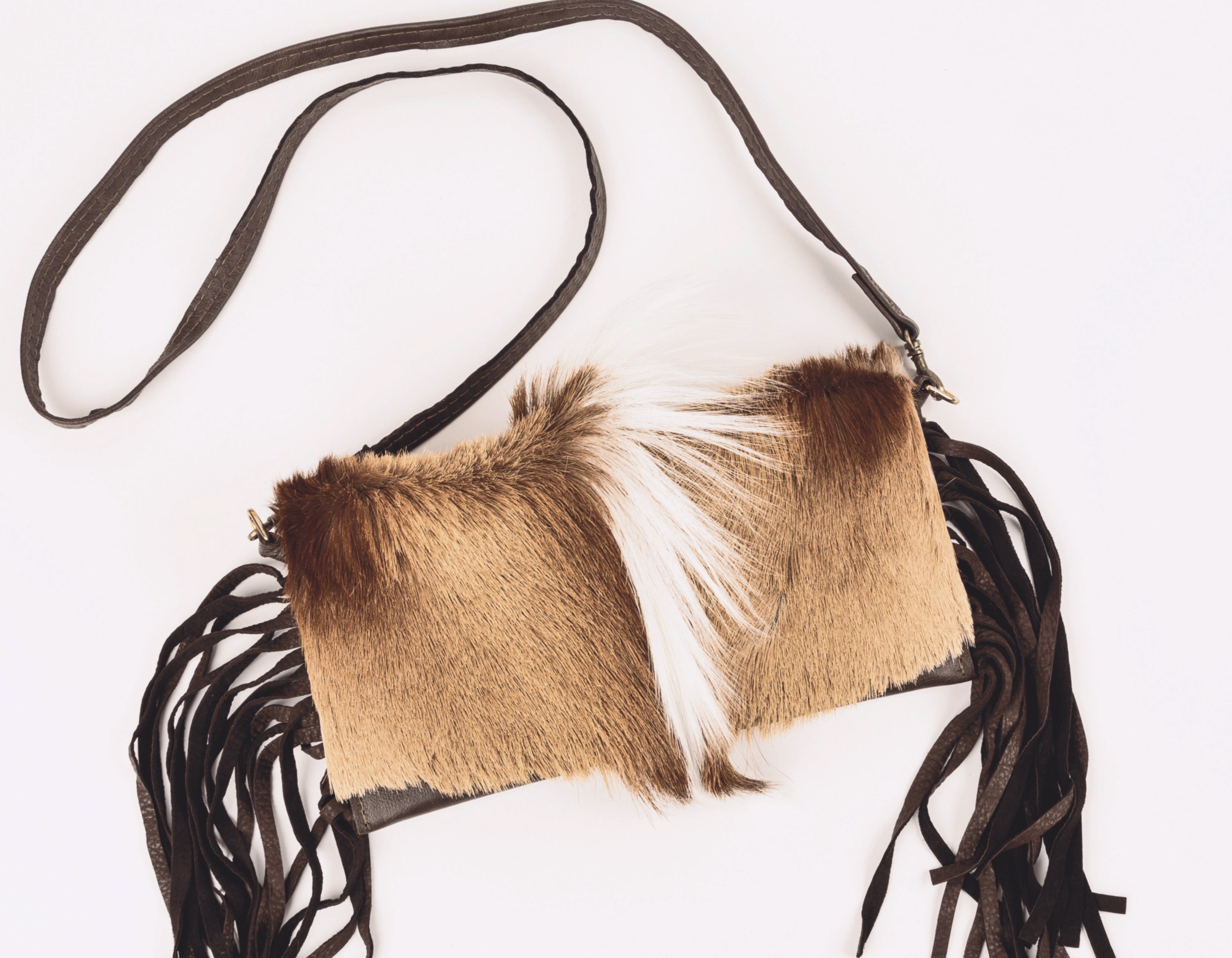 Springbok flap with brown leather Crossbody strap.